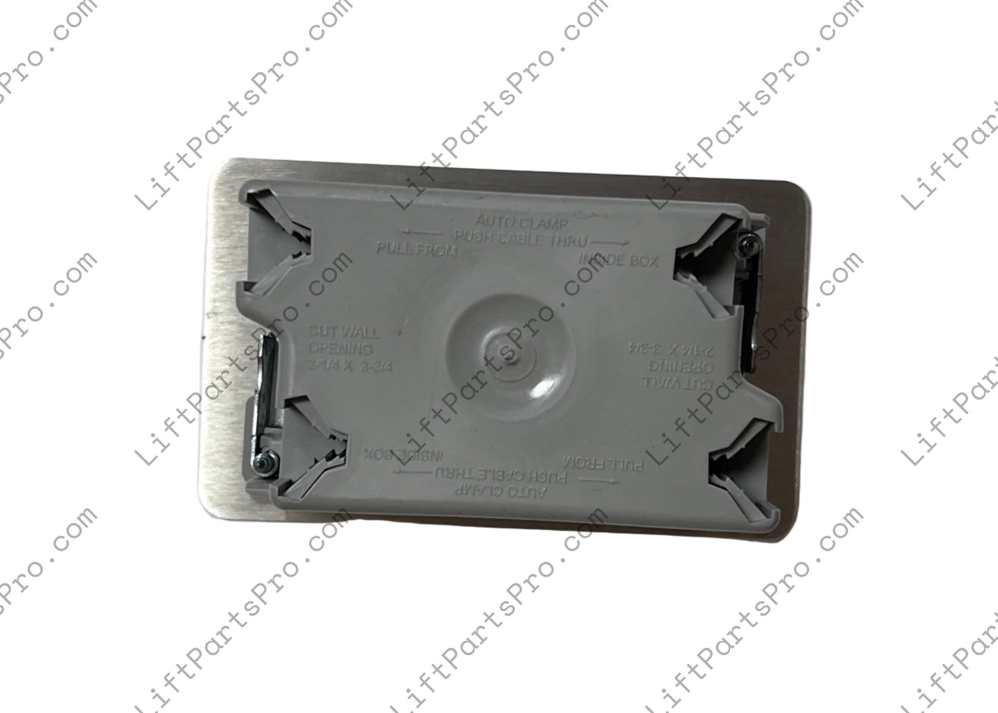 Reverse side of hall call station depicting gray plastic box.