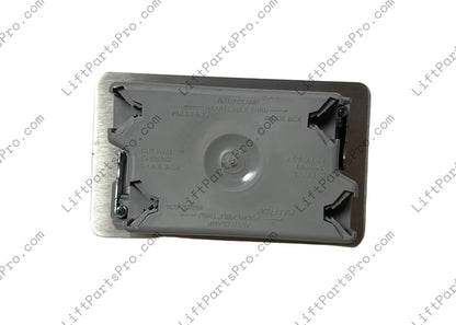 Reverse side of hall call station depicting gray plastic box.