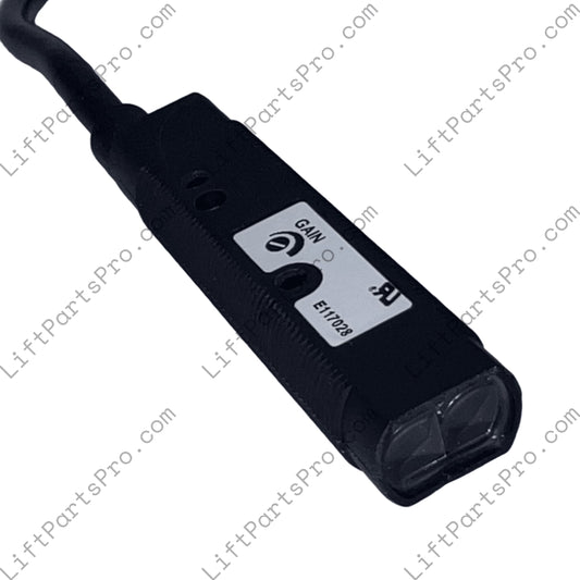 Black electronic device with labeled controls on a white surface